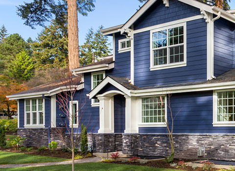 Image of a blue house with white trim